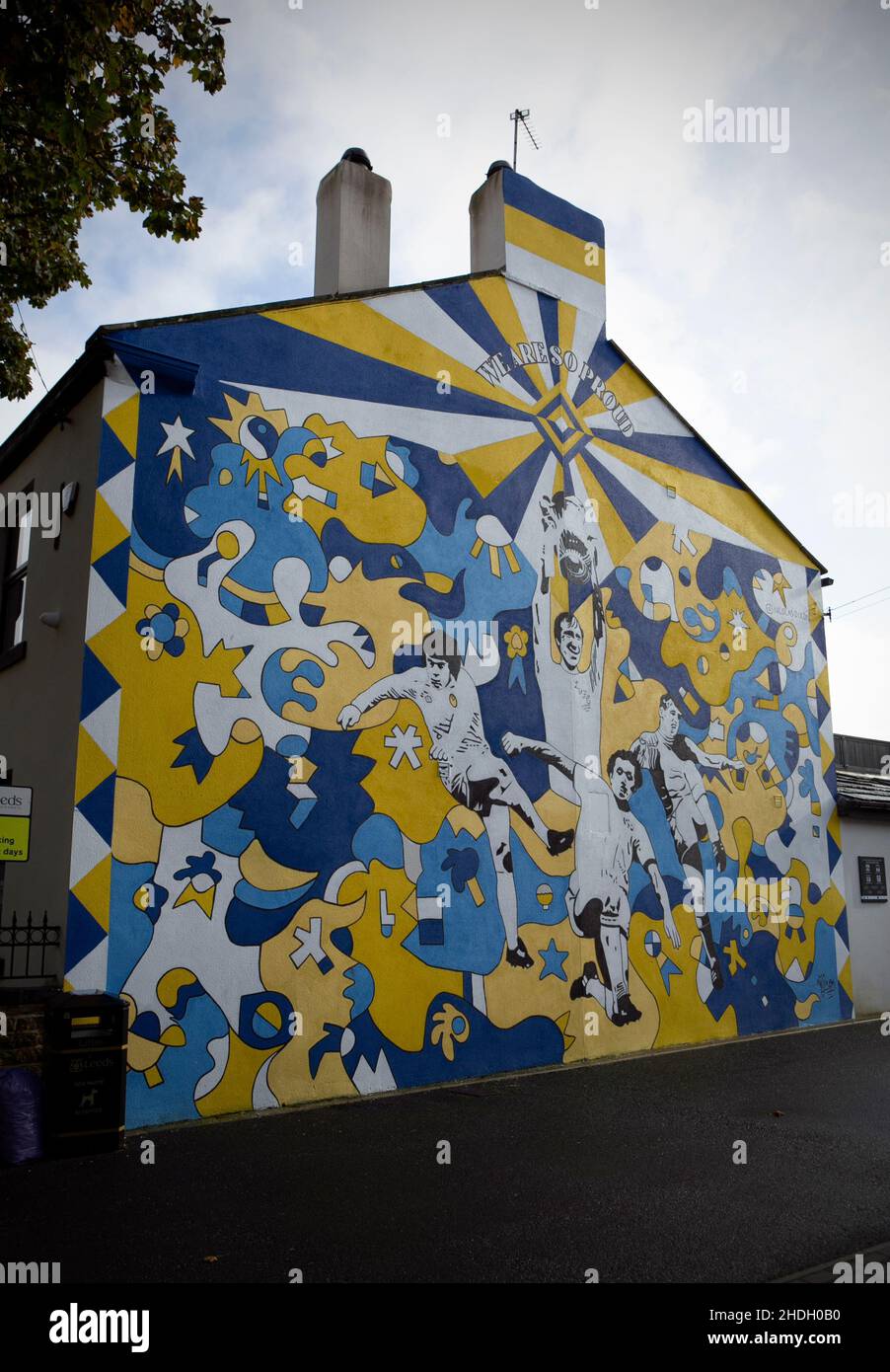 A football mural on the side of a house showing former Leeds United players including Jack Charlton on in the Market town of Pudsey in West Yorkshire, Stock Photo