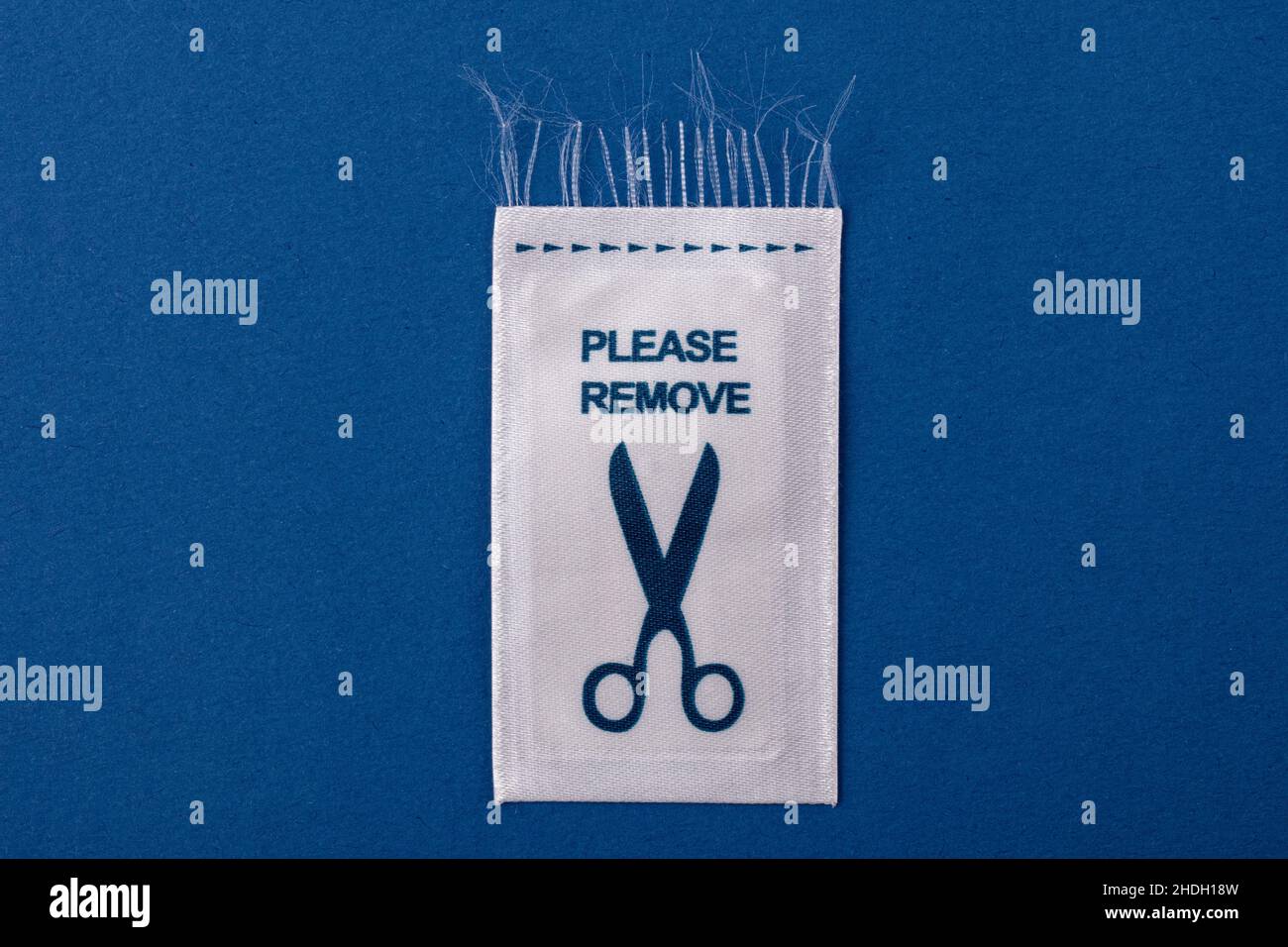 please remove, clothing label Stock Photo Alamy