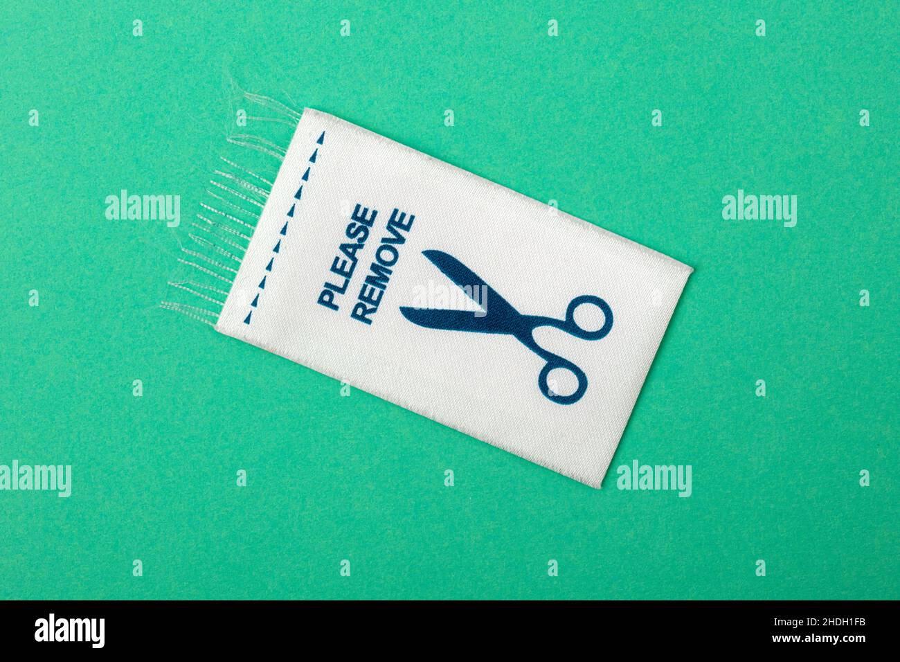 please remove, clothing label Stock Photo Alamy