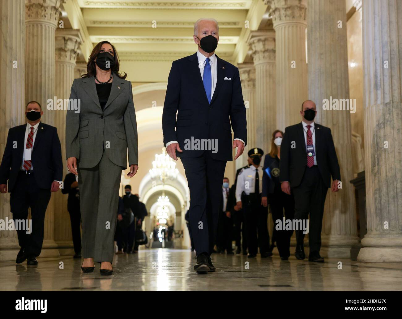 United States President Joe Biden and US Vice President Kamala Harris depart through the Hall of Columns following remarks to mark the first anniversary of the January 6, 2021 attack on the U.S. Capitol by supporters of former President Donald Trump, on Capitol Hill in Washington, U.S., January 6, 2022. Credit: Evelyn Hockstein/Pool via CNP /MediaPunch Stock Photo