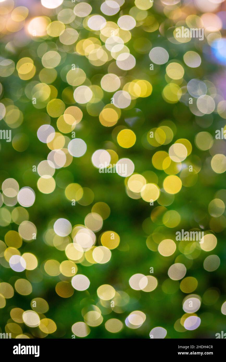 Beautiful bokeh effect. Blurred bright festive Christmas background. Stock Photo