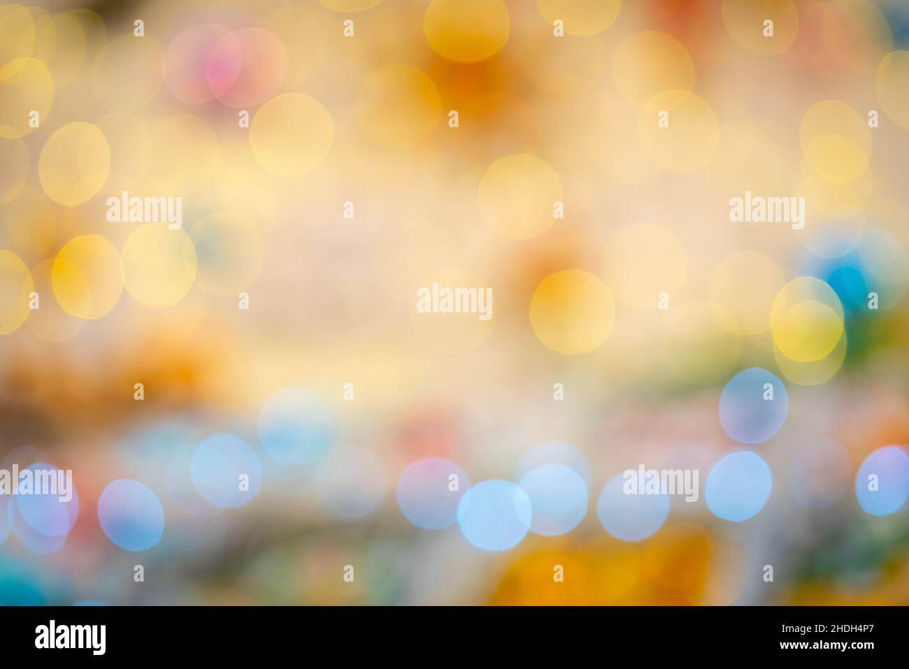 Beautiful bokeh effect. Blurred bright festive Christmas background. Stock Photo