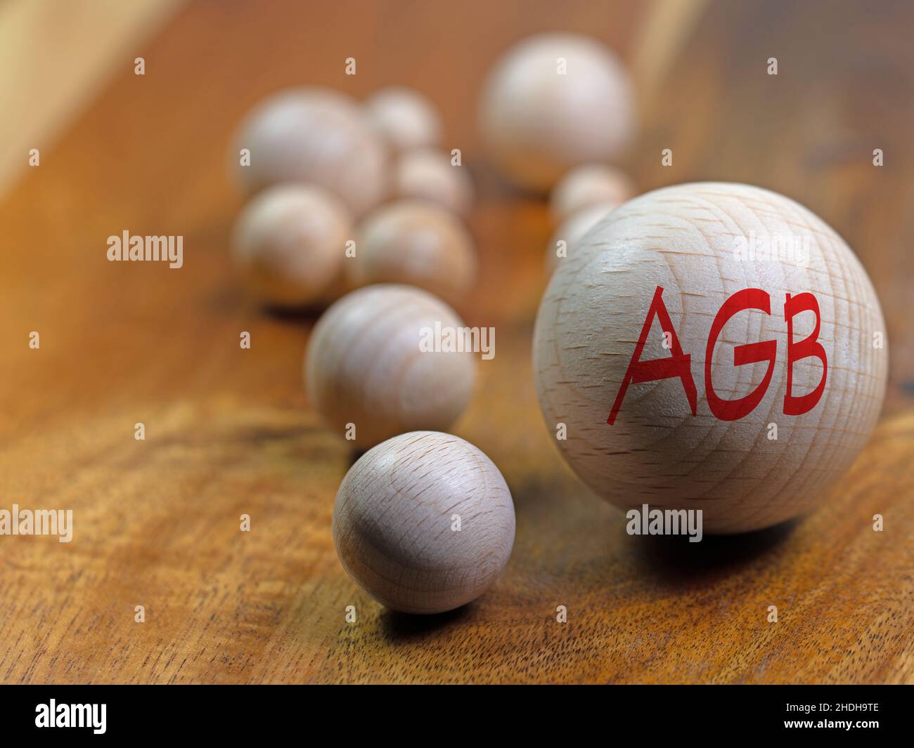 Wooden ball with the imprint 'AGB', translation 'Terms and conditions' Stock Photo