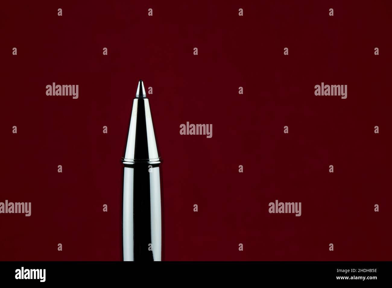 Upright roller ball pen isolated on a red background Stock Photo