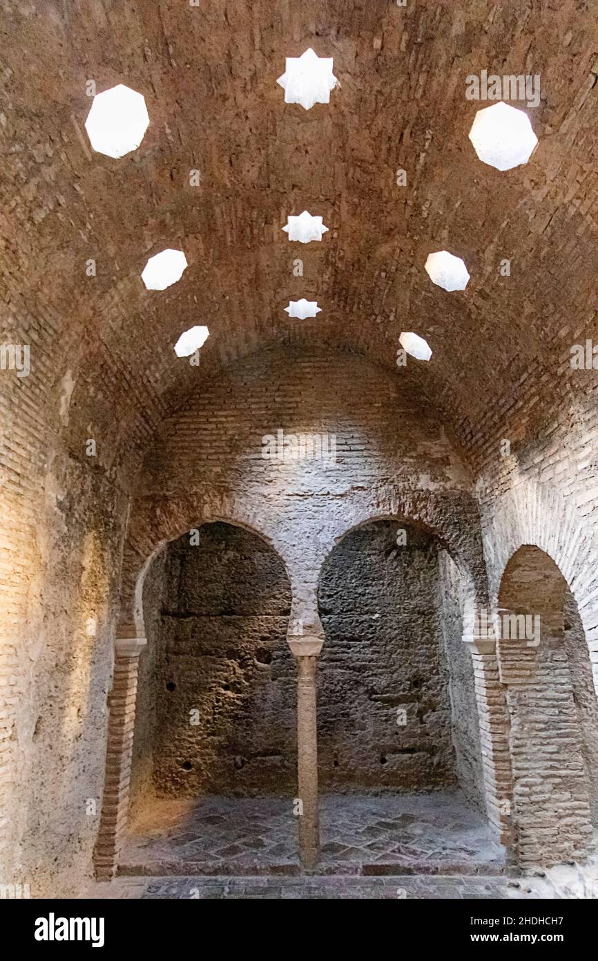 GRANADA ANDALUCIA SPAIN EL BAÑUELO ARAB BATHS INTERIOR VIEW SKYLIGHTS AND BRICKWORK DETAIL Stock Photo