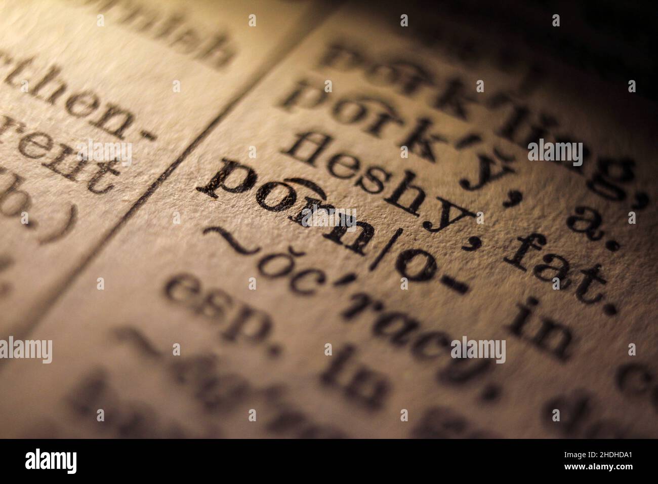 Word 'porno' and 'porn' printed on dictionary page, macro close-up Stock Photo