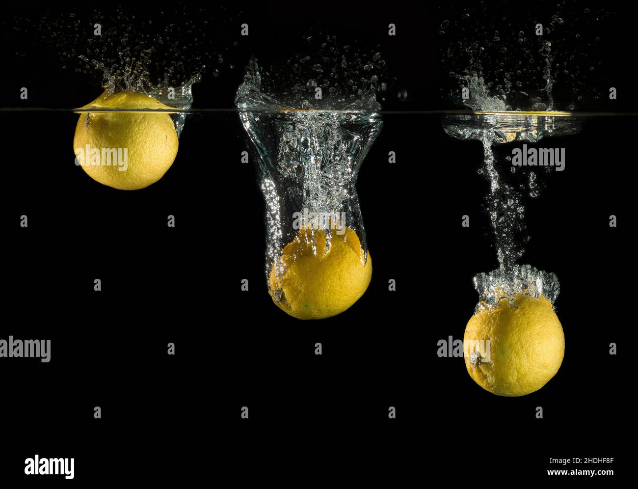 Splashed Lemon Lemon water splash black hi-res stock photography and images - Alamy