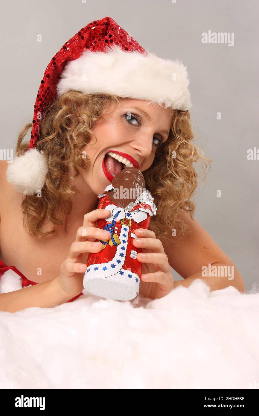 chocolate santa claus, mrs claus, biting, chocolate santa, bite, to bite Stock Photo