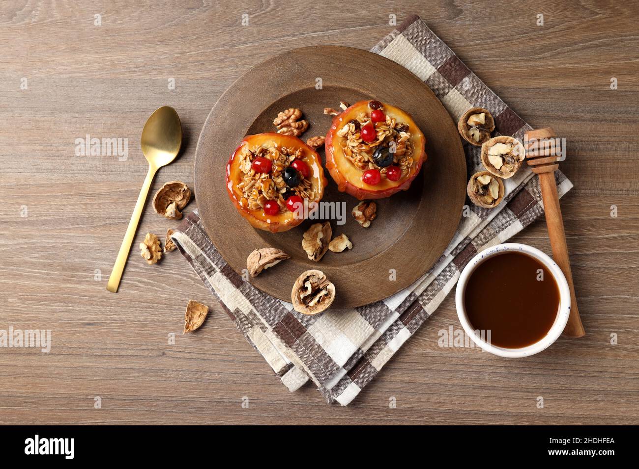 Concept of tasty food with baked apples on wooden background Stock Photo