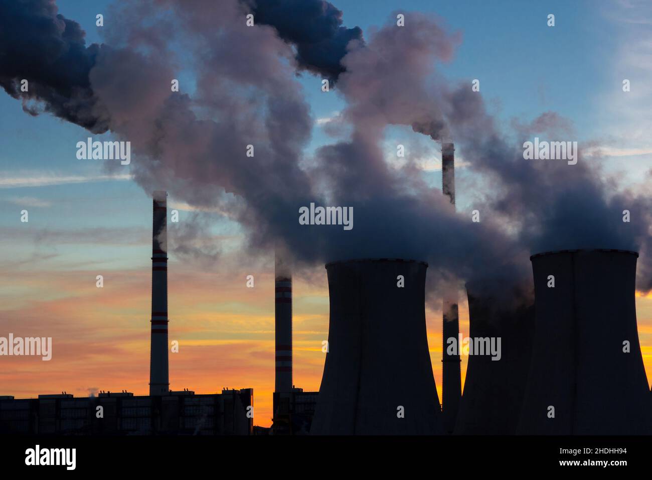 Coal burning powerplant in front of evening sky Stock Photo