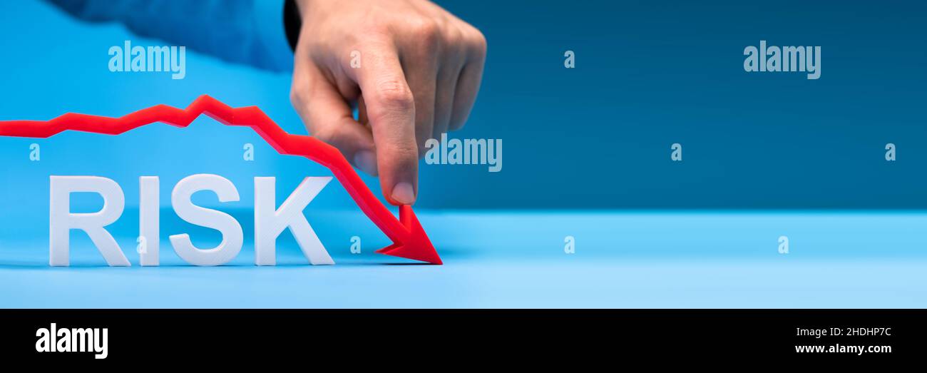 Invest In Finance With Less Risk. Risk Going Down Stock Photo - Alamy