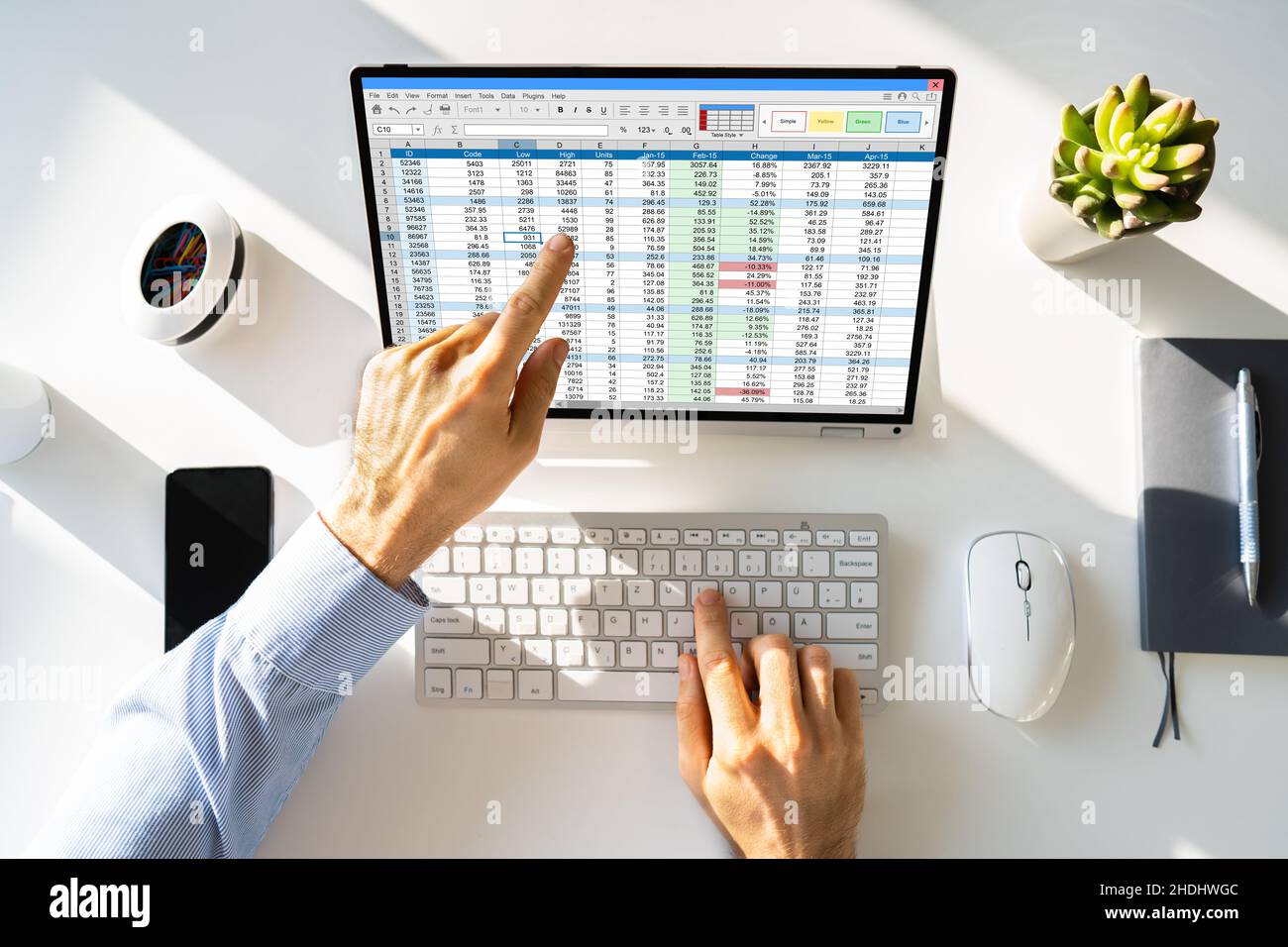 Electronic Spreadsheet Analyst Or Auditor Using Software On Hybrid Laptop Stock Photo