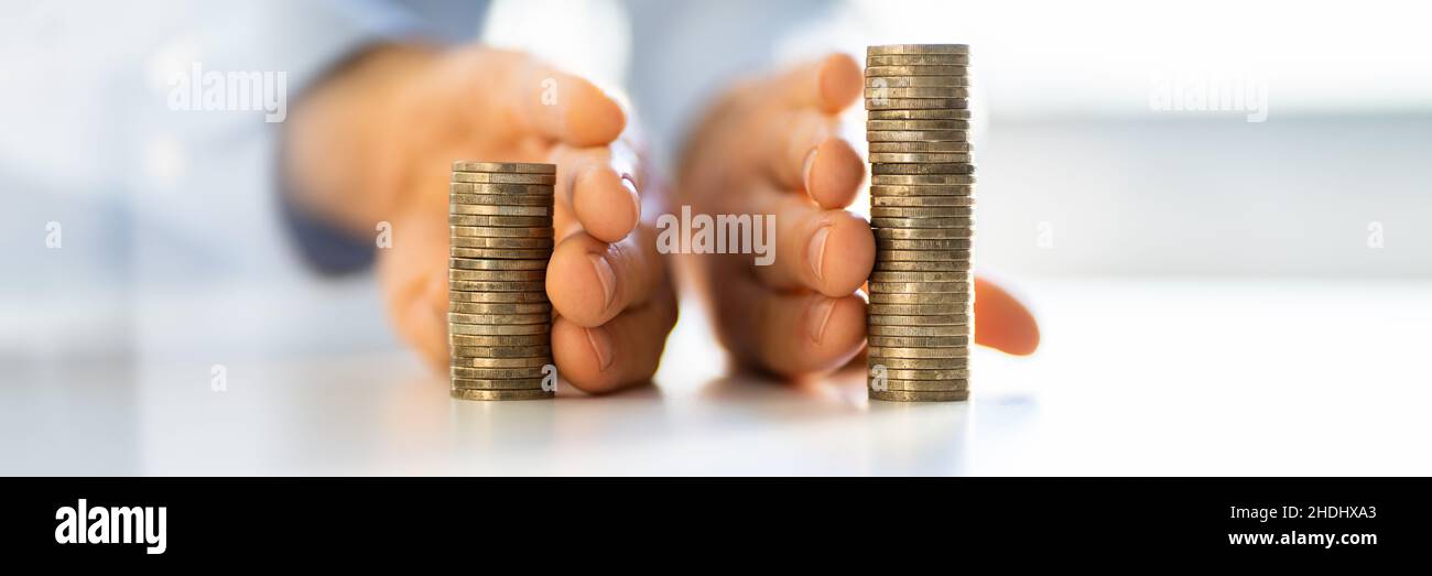 Separating Money Stack In Divorce. Saving Income Stock Photo