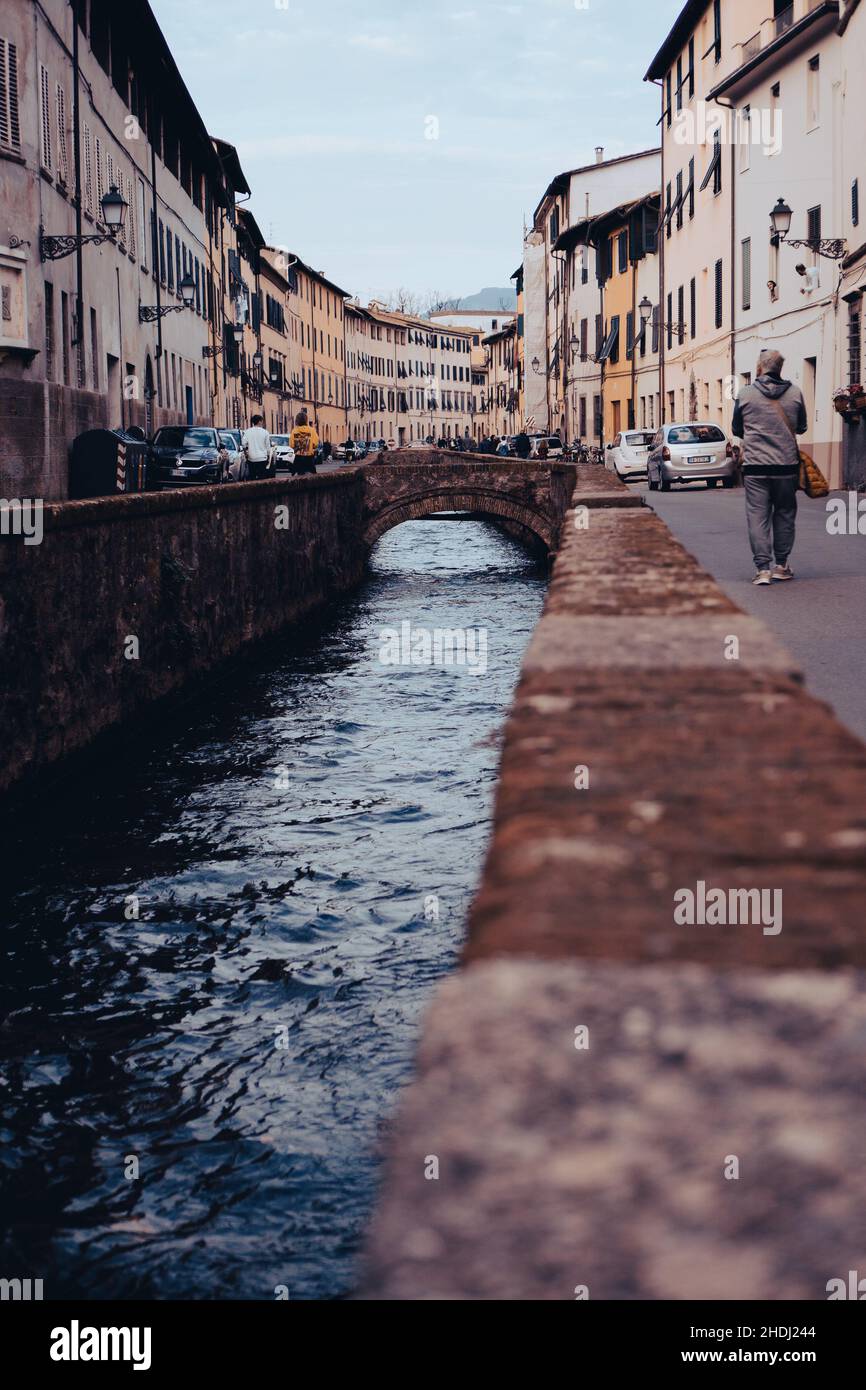 Water stream cross the city of Lucca Stock Photo