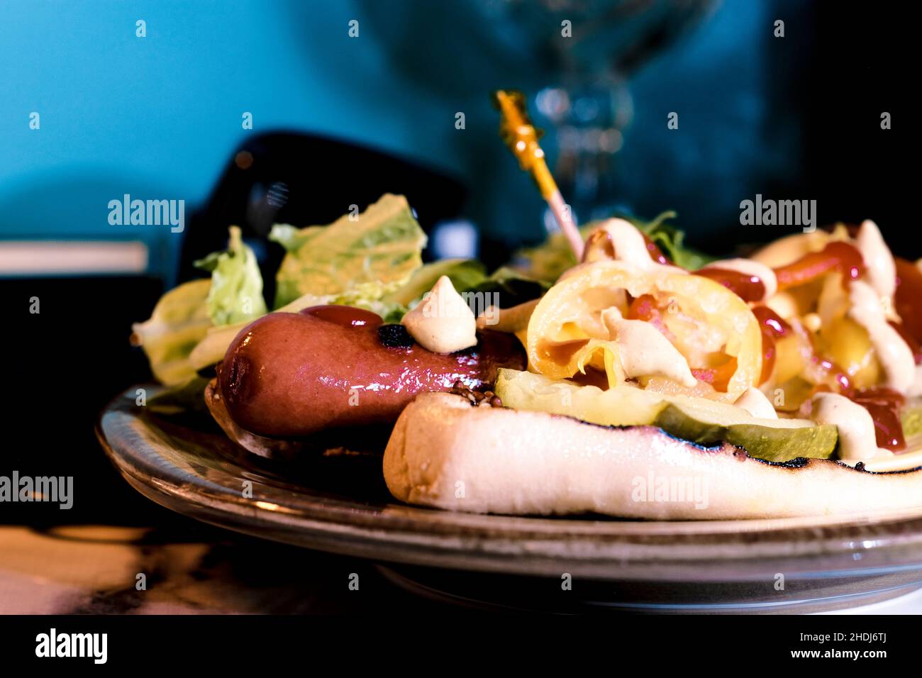 The works hot dog with retro landline corded phone in the background Stock Photo