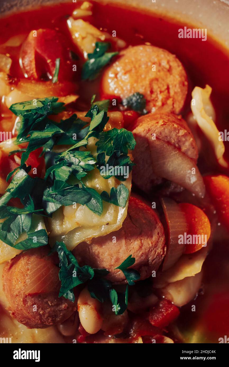 Traditional Polish cabbage kielbasa sausage and bean soup Stock Photo