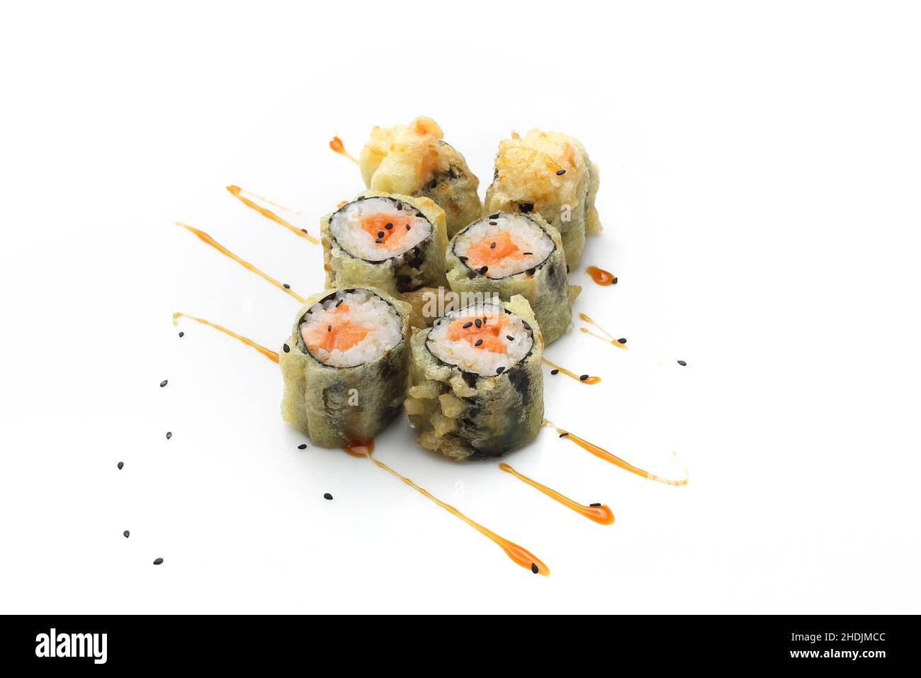 Sushi with salmon in tempura Traditional sushi rolls on a white background. Stock Photo