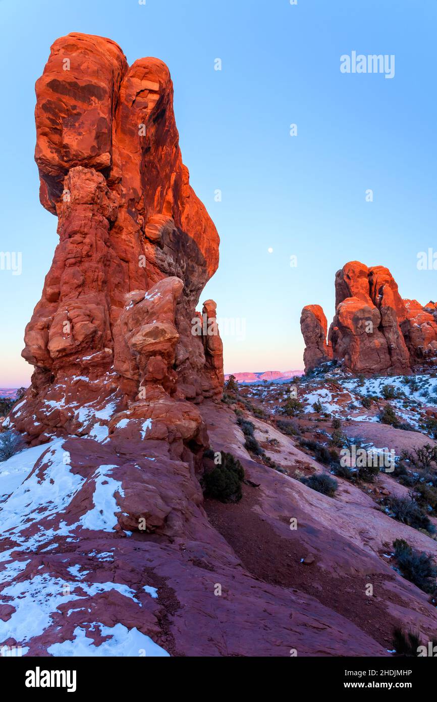 Moon rise and the last ray of the sun light over The Garden of Eden, Arches National Park, Utah Stock Photo