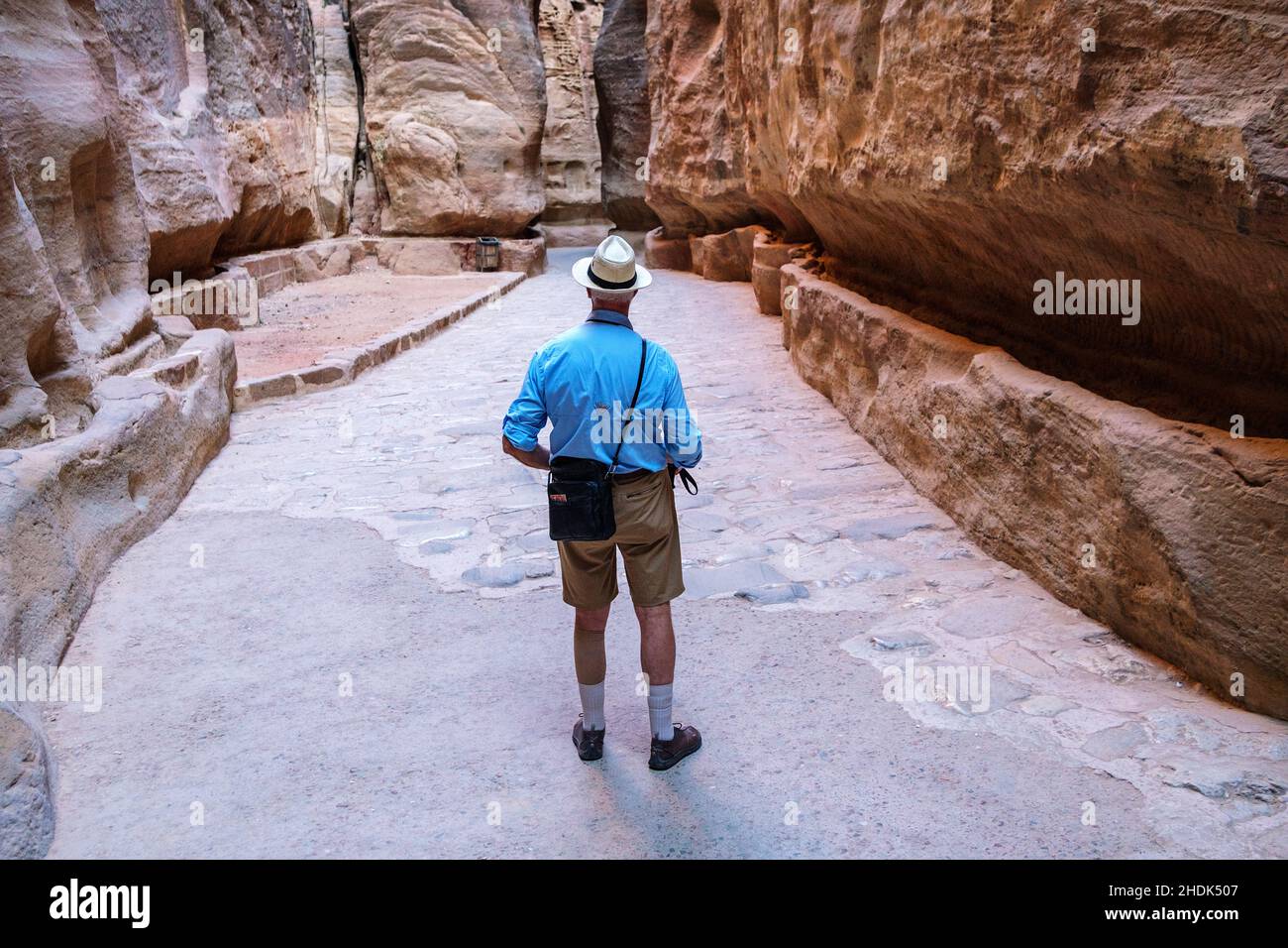 A foreign tourist in the Siq canyon, Petra, Jordan. Stock Photo