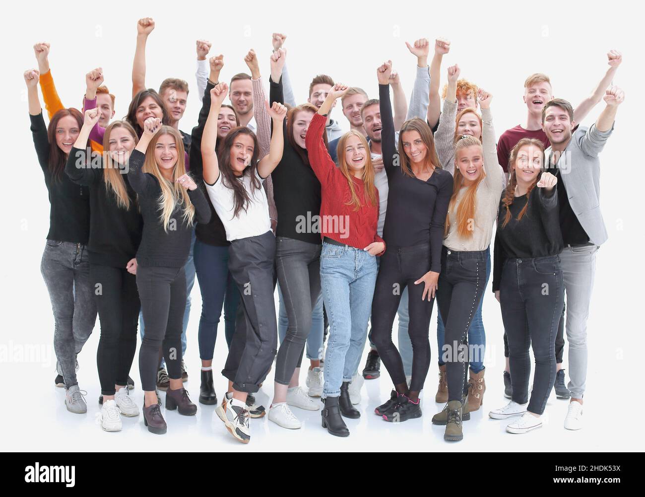 group of confident young people standing with their hands up Stock ...