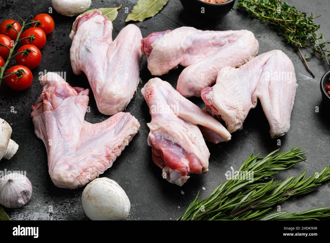 Raw turkey wings on black Slate Tray. Fresh turkey wingette on a black  stone tray Stock Photo - Alamy