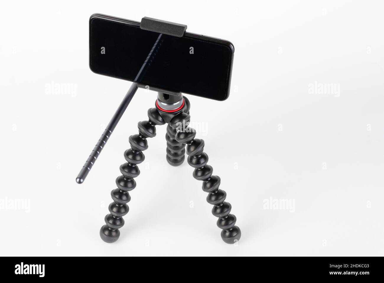 Touch screen smartphone on mount and flexible tripod. Stock Photo