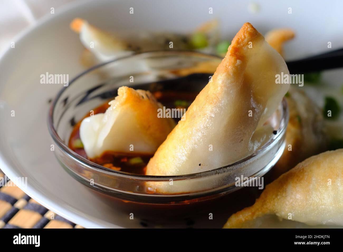 Homemade fried Asian potsticker dumpling appetizer with spicy ponzu