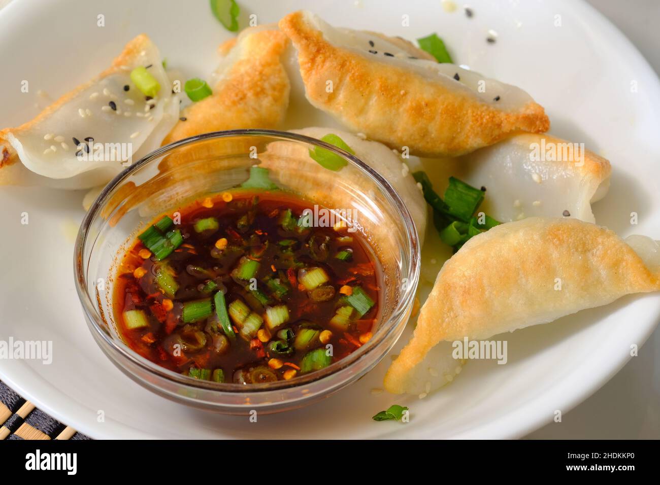Homemade fried Asian potsticker dumpling appetizer with spicy ponzu