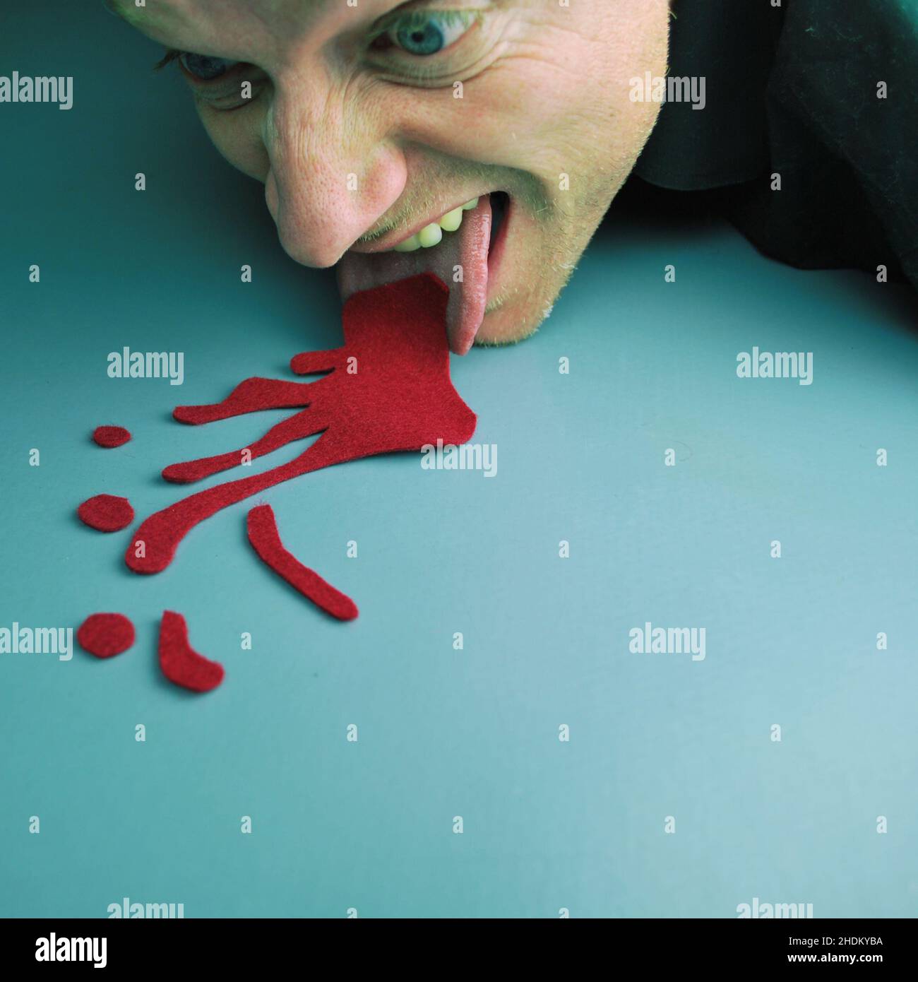 Licking blood hires stock photography and images Alamy