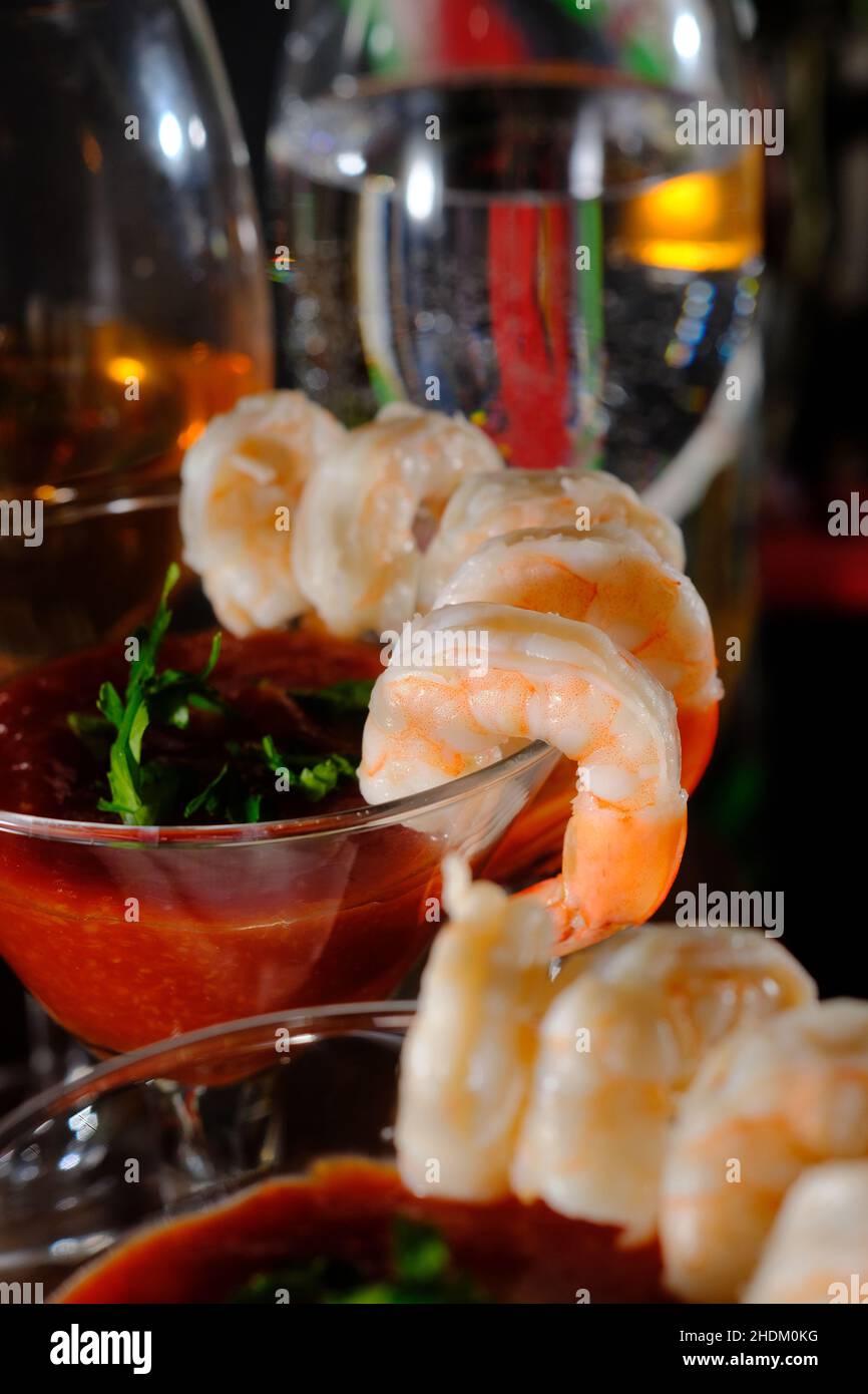 Delightful tailon shrimp cocktail served with horseradish dipping sauce in martini glass Stock