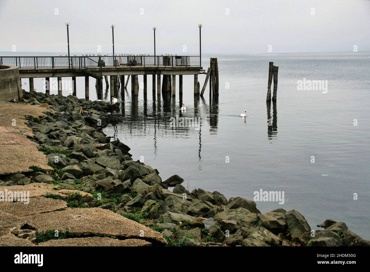 A shot of a pier in Trevignano in winter, on the lake of Bracciano in Italy Stock Photo