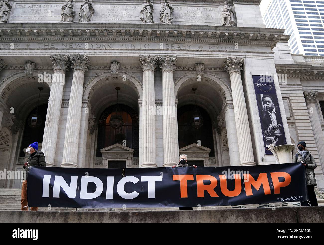 Protesters hold an 'Indict Trump' banner during a protest to support indictments in the January, 6, 2021 Capitol Hill riots in the Manhattan borough of New York City, New York, U.S., January 6, 2022.  REUTERS/Carlo Allegri Stock Photo