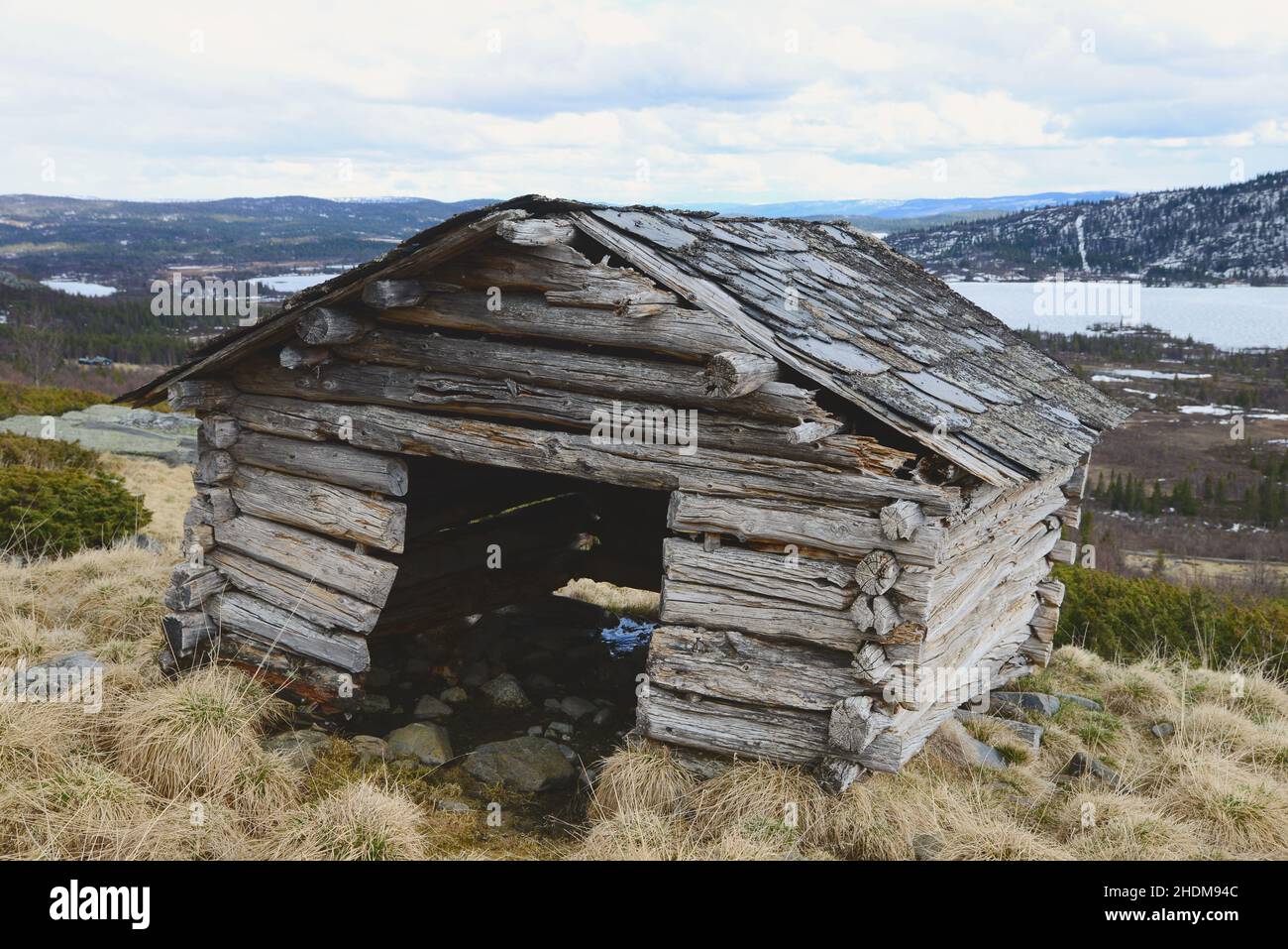 Old dilapidated log building in a mountain area in Hallingdal Norway. Stock Photo
