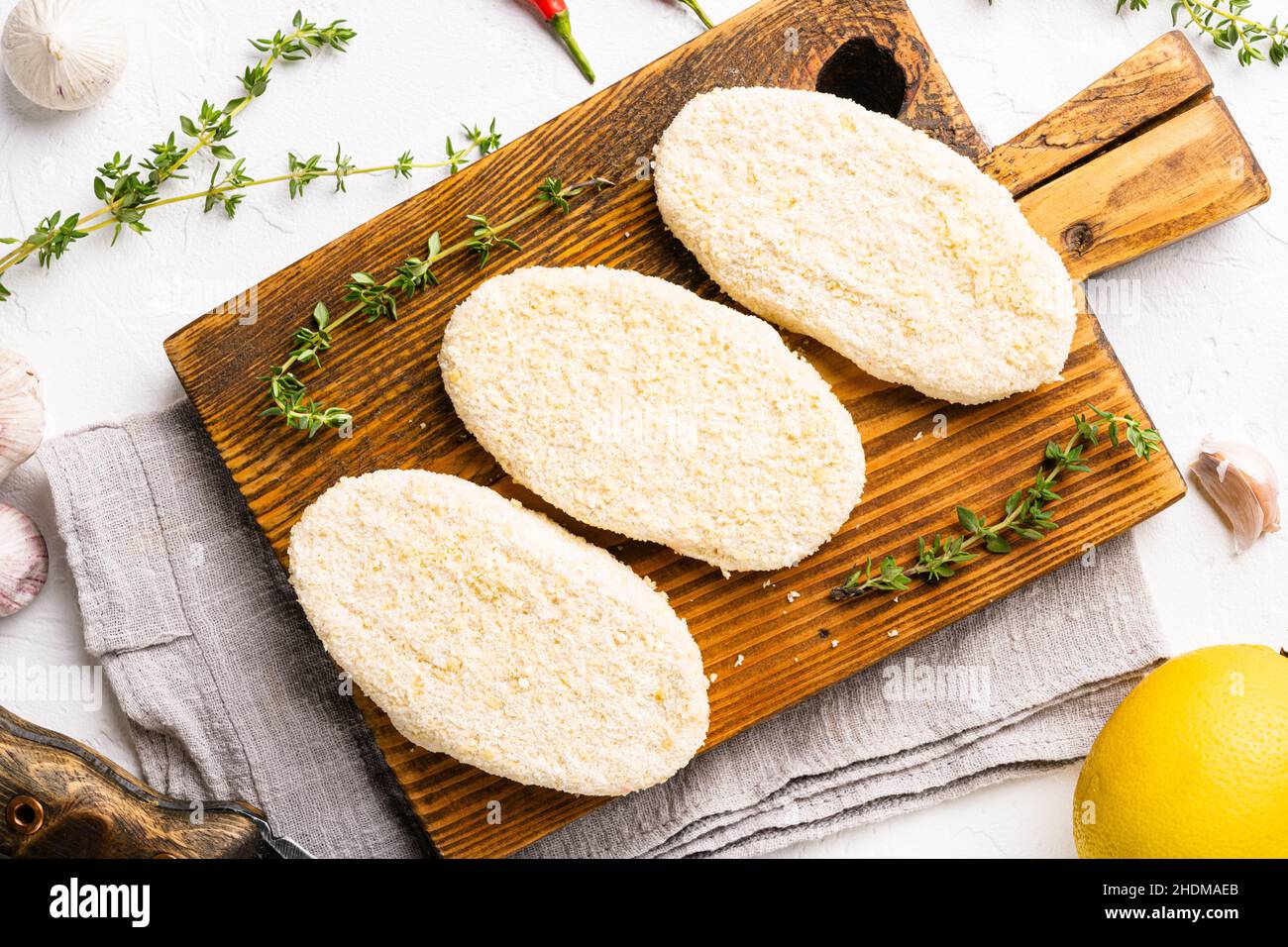 Fish cutlets from minced cod set, on white stone table background, top view flat lay Stock Photo
