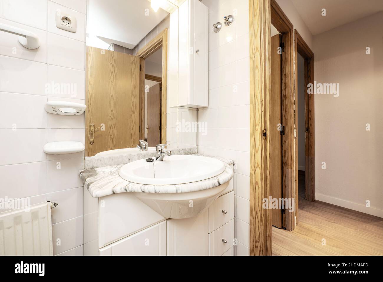 Toilet with white marble countertop and sink Stock Photo