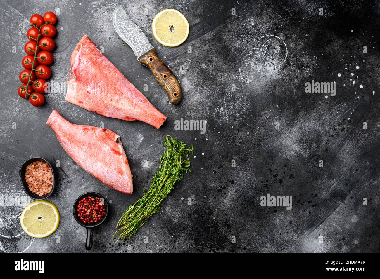 Whole raw red snapper fish set, on black dark stone table background ...