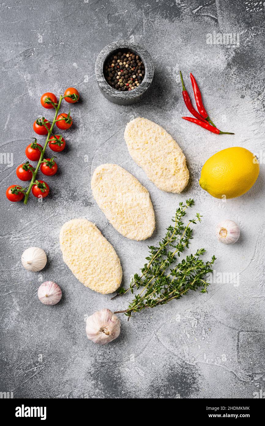 Frozen uncooked fishcake, on gray stone table background, top view flat ...