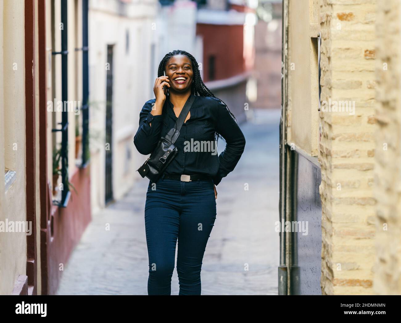 African woman walking hi-res stock photography and images - Alamy