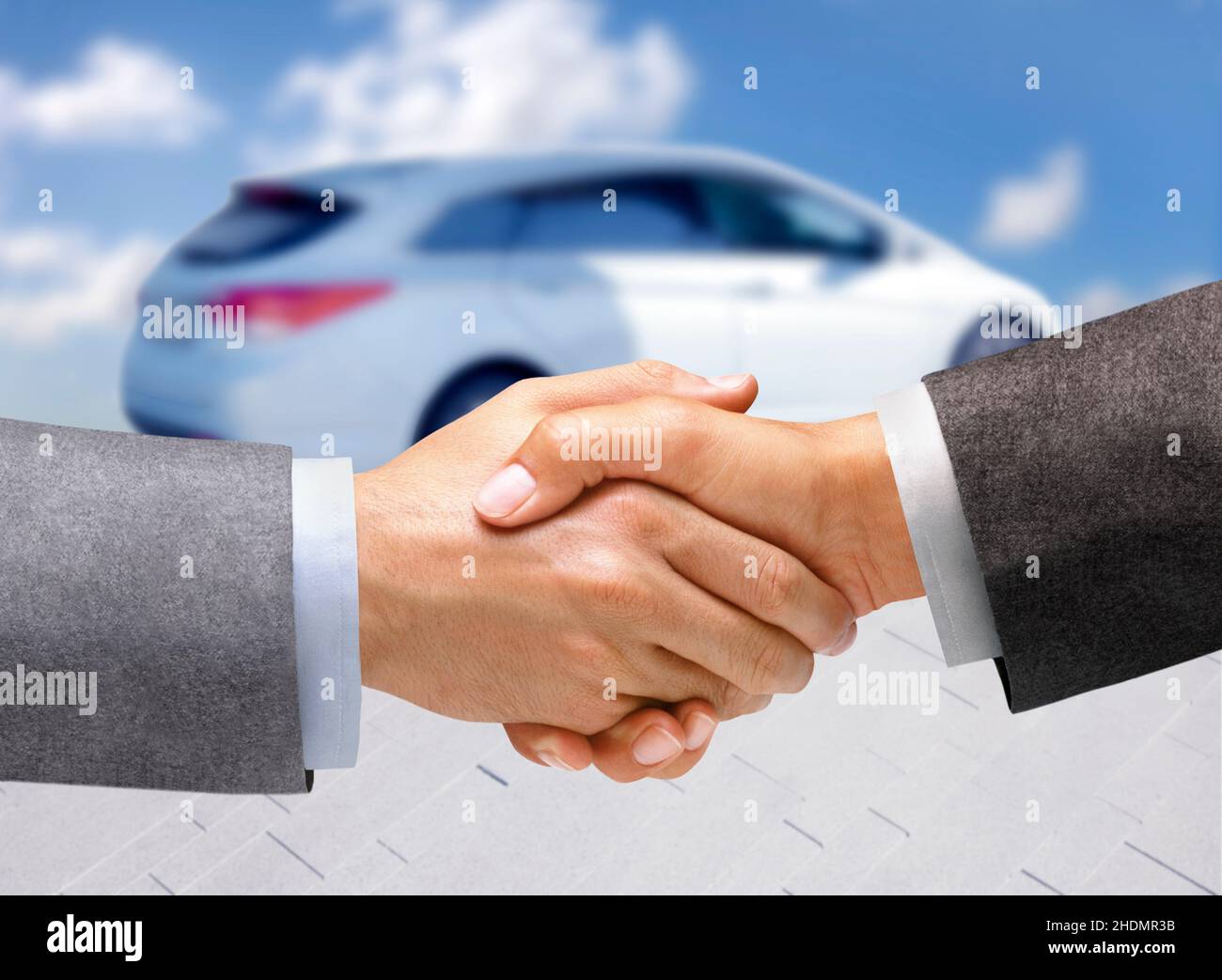 handshake, car buying, auto trade, agreement, handshakes, shaking hands, buying a car, to by a car, auto trades Stock Photo