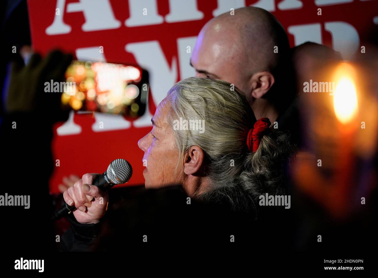 Micki Witthoeft, mother of protester Ashli Babbitt, who was shot dead by a police officer during the January 6, 2021 attack on the U.S. Capitol, talks to the media next to Matt Braynard, Executive Director of Look Ahead America, as supporters of former U.S. President Donald Trump gather outside the D.C. Jail in Washington to protest the detention of those who have been charged with various offenses during the January 6, 2021 attack on the U.S. Capitol by Trump supporters, in Washington, U.S., January 6, 2022. REUTERS/Elizabeth Frantz Stock Photo
