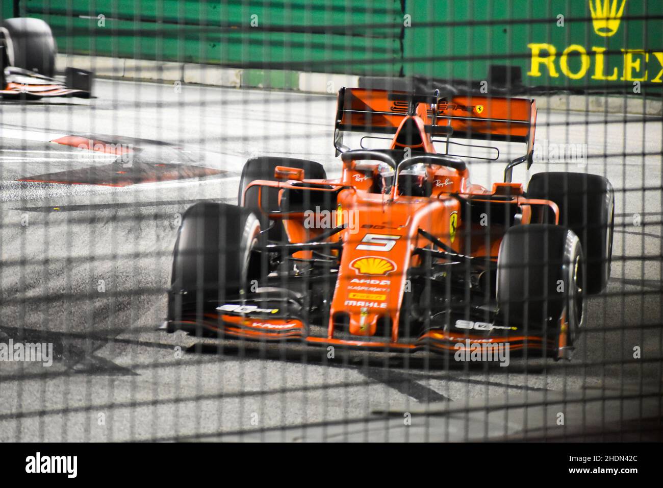 Sebastian Vettel navigating the singapore street circuit during the 2019 F1 GP