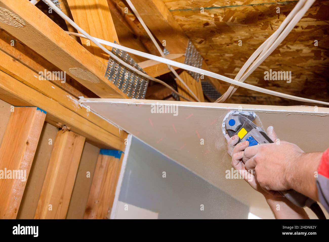 Cutting plasterboard plaster hand sawzall tool Stock Photo Alamy