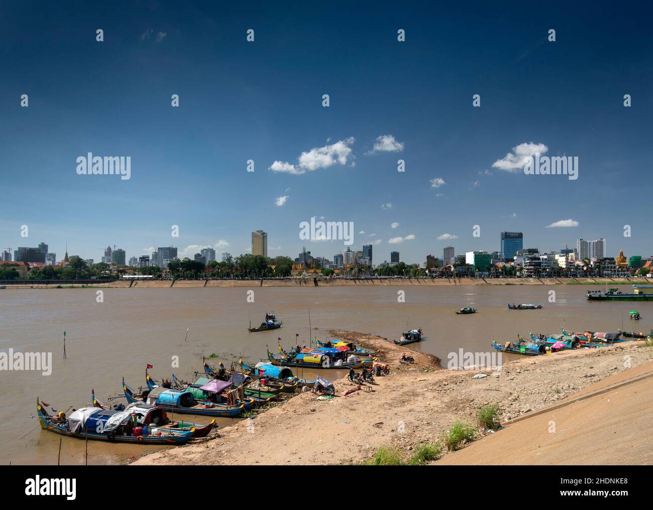 cham commmunity floating house boat village on tonle sap river with phnom penh city skyline in cambodia Stock Photo