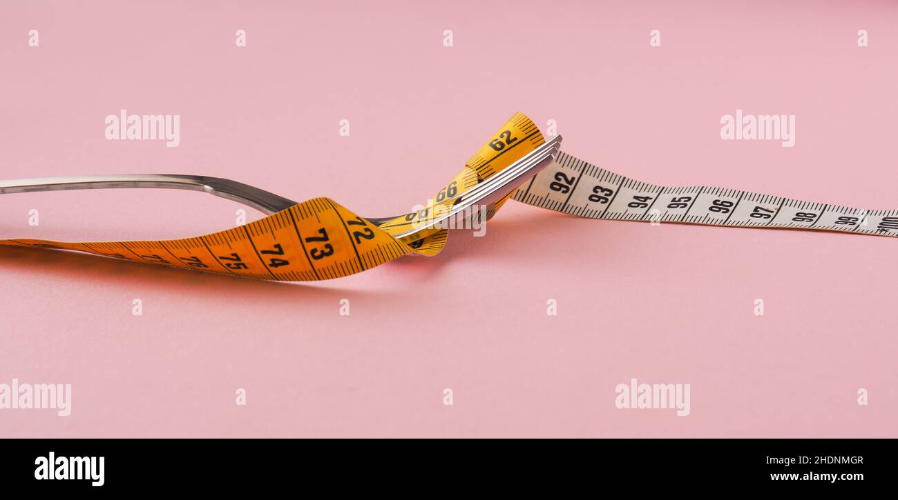 https://c8.alamy.com/comp/2HDNMGR/diet-tape-measure-weight-diets-tape-measures-weights-2HDNMGR.jpg