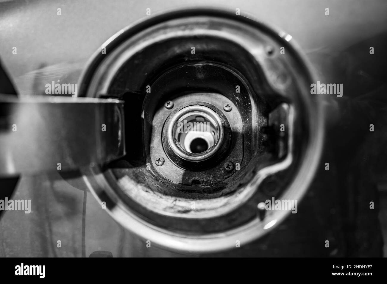 Open lid and removed gas cap of a vehicle ready to be fueled Stock