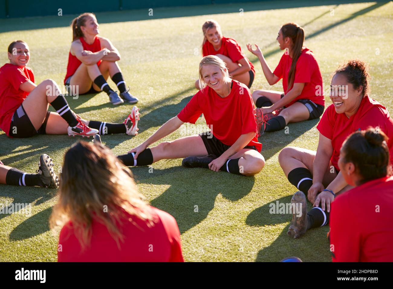 stretching, warming up, soccer player, soccer training, stretch, warm