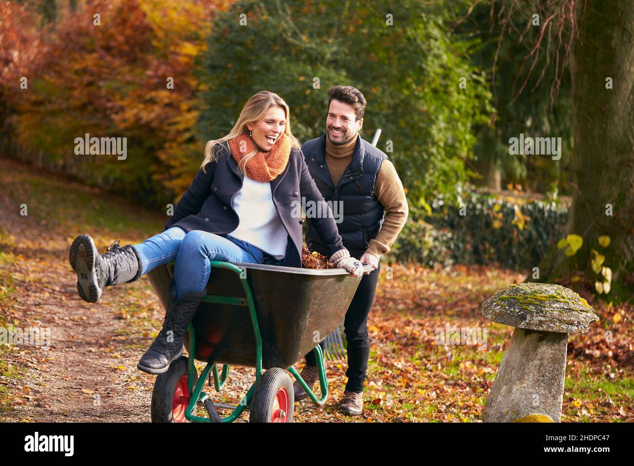 couple, autumn leaves, fun, gardening, pairs, leaf, funs, plant care, tending of plants Stock Photo