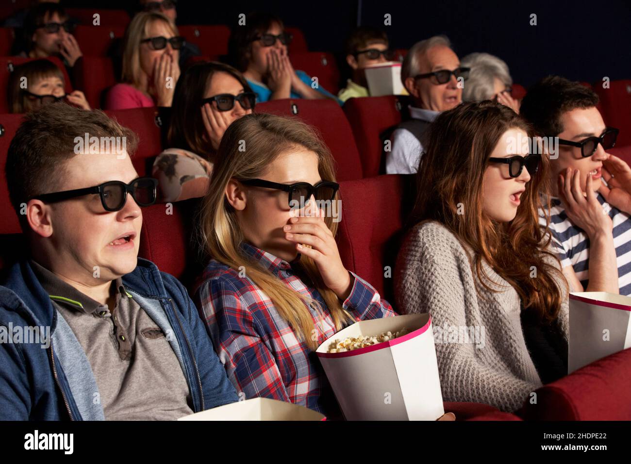 Teen scared movie theater hi-res stock photography and images - Alamy