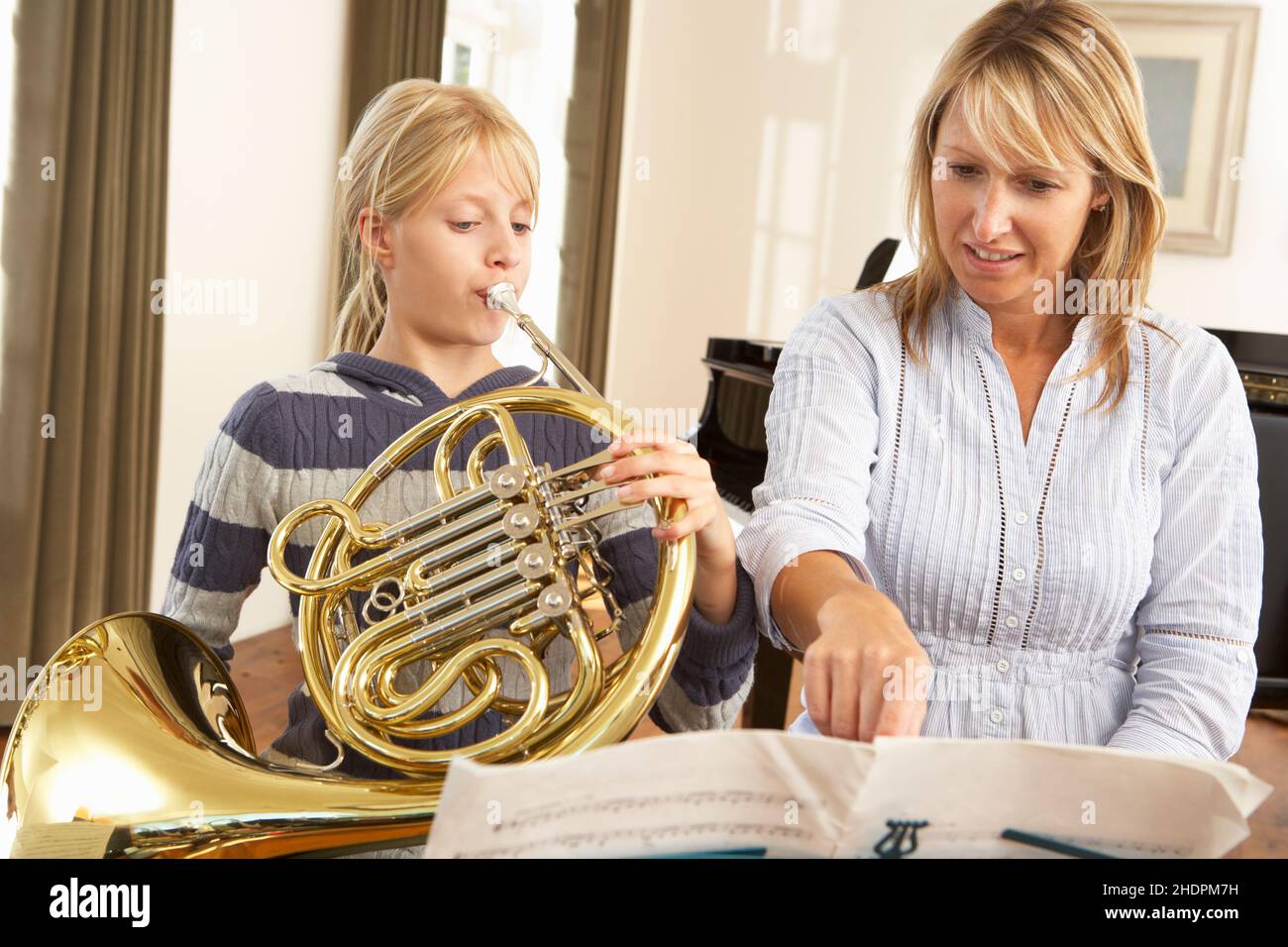 french horn, music schoolgirl, music teacher, bugles Stock Photo Alamy