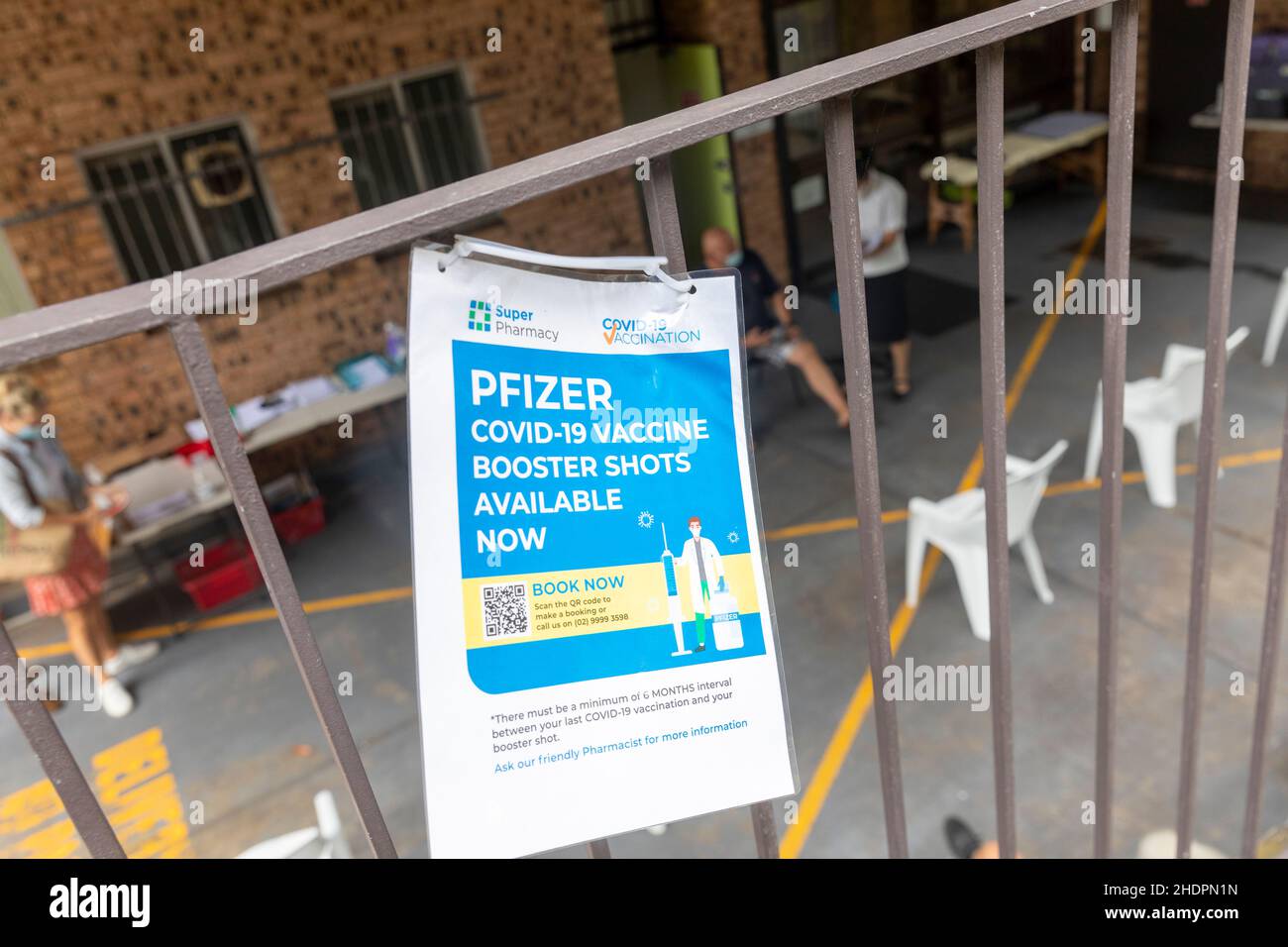 Pfizer covid 19 booster vaccines being administered outside at a Sydney chemist pharmacy,NSW,Australia Stock Photo